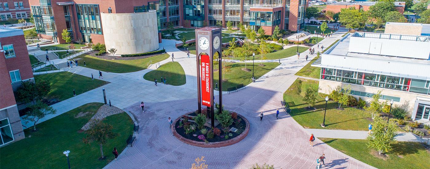 Frostburg State students walk to and from class by the clocktower in the middle of campus