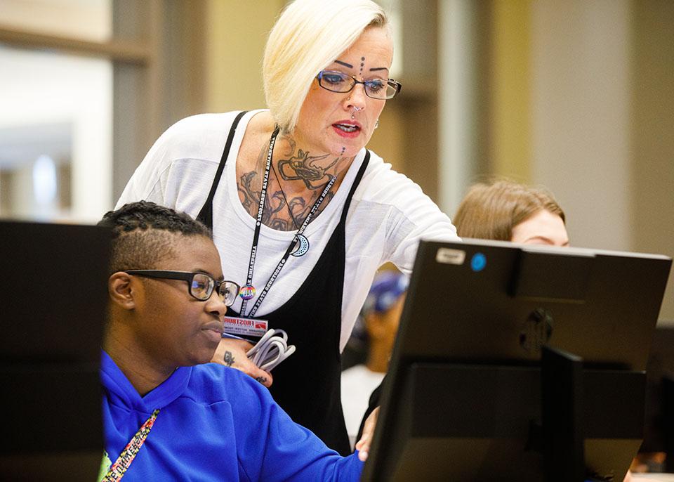 female faculty assists student